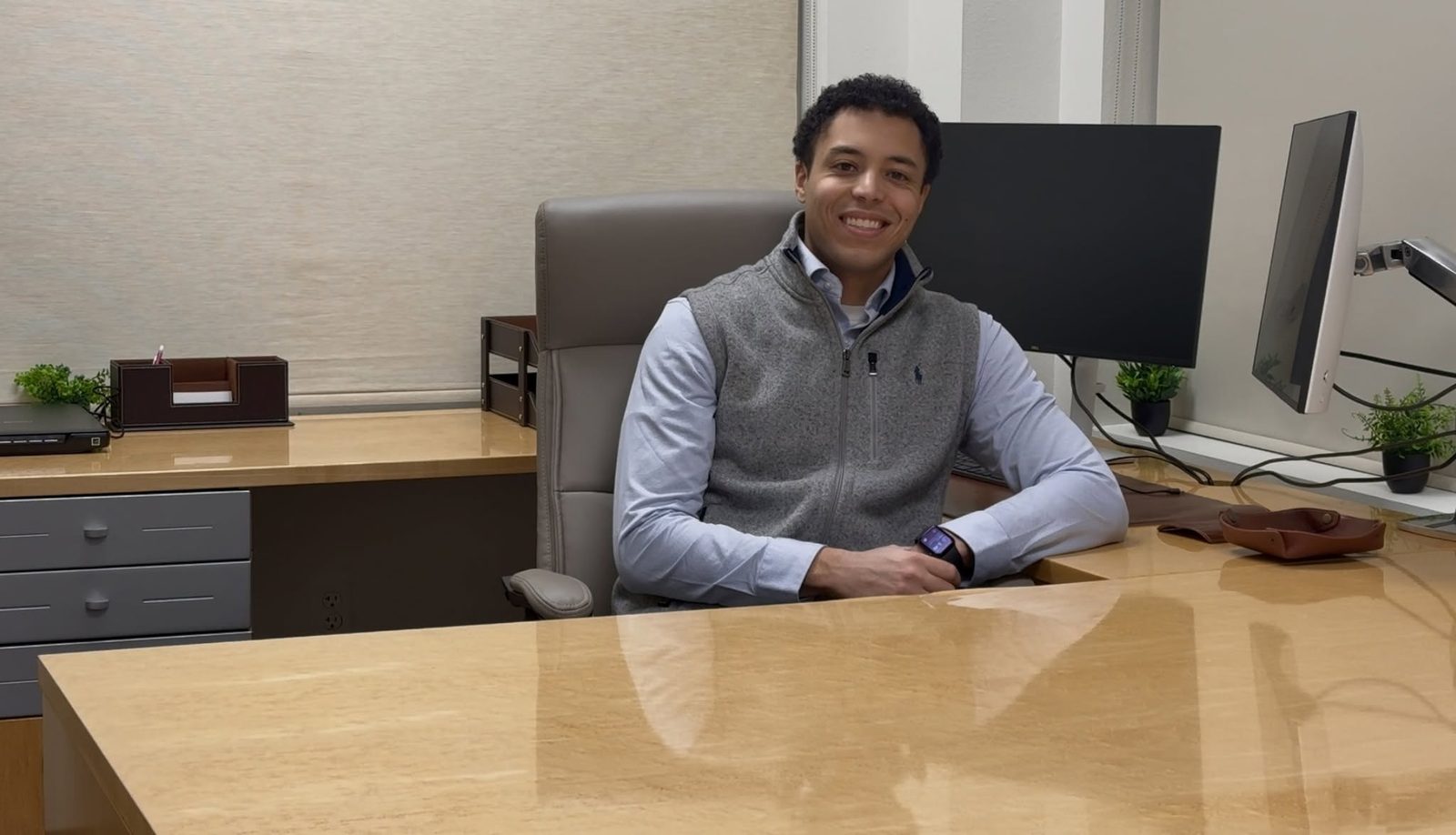 Brandon at his desk in the Ankeny office